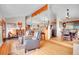 Open-concept living area with hardwood floors, comfortable seating, and dining space at 9648 Yegge Rd, Morrison, CO 80465