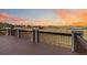 Spacious outdoor deck offering panoramic views of rolling hills and a serene landscape at 6743 Serena Ave, Castle Pines, CO 80108