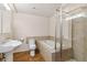 Modern bathroom with a shower, soaking tub, sink, toilet and tile floors at 6743 Serena Ave, Castle Pines, CO 80108
