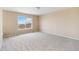 Bedroom with neutral carpet, paint, and an expansive view from the bright window at 6743 Serena Ave, Castle Pines, CO 80108
