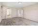Spacious bedroom with neutral paint, carpet floors, and access to ensuite bathroom at 6743 Serena Ave, Castle Pines, CO 80108