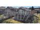 Exterior aerial showing multiple decks, covered patio, fencing and mature landscaping at 6743 Serena Ave, Castle Pines, CO 80108