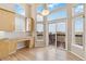 Eat-in kitchen area boasts large windows, a sliding glass door, and abundant natural light at 6743 Serena Ave, Castle Pines, CO 80108