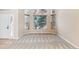 Bright and airy living room with large windows and neutral carpeting at 6743 Serena Ave, Castle Pines, CO 80108