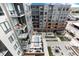 Aerial perspective showcases multiple building balconies, a pool, outdoor seating, and modern landscaping at 20 Wilcox St # 410, Castle Rock, CO 80104