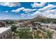 Aerial view of the city with landscaped grounds and mountain views on a sunny day at 20 Wilcox St # 410, Castle Rock, CO 80104
