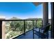 Balcony seating with a view of tree-lined streets and mountain at 20 Wilcox St # 410, Castle Rock, CO 80104
