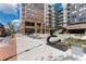 Modern building with a large sculpture, sidewalk, and outdoor seating areas at 20 Wilcox St # 410, Castle Rock, CO 80104