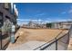 Fenced dog park with rocks and a sandy play area for residents and their pets at 20 Wilcox St # 410, Castle Rock, CO 80104