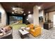 Luxurious entertainment room with a golf simulator, comfortable seating, and a wet bar at 20 Wilcox St # 410, Castle Rock, CO 80104
