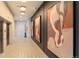 Apartment hallway featuring modern art pieces, sleek design, and access to elevators at 20 Wilcox St # 410, Castle Rock, CO 80104
