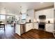 Kitchen with stainless appliances, breakfast bar, hardwood floors and views of the living area at 20 Wilcox St # 410, Castle Rock, CO 80104