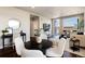 A bright and airy living room with views and a dining area with modern decor at 20 Wilcox St # 410, Castle Rock, CO 80104