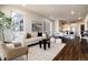 Bright living room with modern furnishings, hardwood floors, and large windows overlooking a city view at 20 Wilcox St # 410, Castle Rock, CO 80104