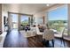 Bright living room featuring hardwood floors, modern furnishings, and large windows with scenic views at 20 Wilcox St # 410, Castle Rock, CO 80104