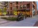 Outdoor seating areas with sculptures, plants and string lights at night at 20 Wilcox St # 410, Castle Rock, CO 80104