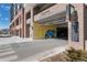 Entrance to the parking garage with a mural, parking signs, and covered access at 20 Wilcox St # 410, Castle Rock, CO 80104