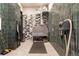 Functional pet wash station with a wash tub, grooming supplies, and tiled walls at 20 Wilcox St # 410, Castle Rock, CO 80104
