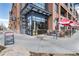 Restaurant exterior with outdoor seating, umbrellas and a menu stand on the sidewalk at 20 Wilcox St # 410, Castle Rock, CO 80104