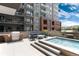 Rooftop patio features a grill, comfortable outdoor seating, and a relaxing pool area at 20 Wilcox St # 410, Castle Rock, CO 80104