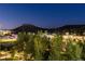 Scenic view of the neighborhood with lush greenery, charming buildings, and a majestic mountain in the distance at 20 Wilcox St # 410, Castle Rock, CO 80104