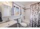 Cozy bathroom featuring a tub, shower, and modern vanity at 208 Wark Ave, Berthoud, CO 80513