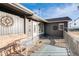 Charming home with a deck, white porch swing, and mountain views at 208 Wark Ave, Berthoud, CO 80513