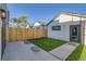 Private backyard with wooden fence, grass, and concrete patio at 2945 S Elati St, Englewood, CO 80110