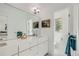Modern bathroom with double vanity, large mirror, and a separate toilet area at 2945 S Elati St, Englewood, CO 80110