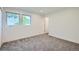 Bright bedroom with carpeted floor and access to a bathroom at 2945 S Elati St, Englewood, CO 80110