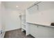 Large walk-in closet with custom shelving and hanging rods at 2945 S Elati St, Englewood, CO 80110