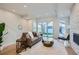 Spacious living area with access to backyard and fireplace at 2945 S Elati St, Englewood, CO 80110