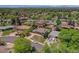 This aerial perspective displays a home with a manicured front lawn in a quiet residential neighborhood at 433 S Vaughn Way, Aurora, CO 80012