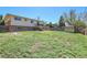 Expansive, fenced backyard boasts a lush lawn and includes a useful storage shed at 433 S Vaughn Way, Aurora, CO 80012