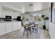 Inviting dining area featuring bright, white walls and modern decor at 433 S Vaughn Way, Aurora, CO 80012