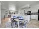 Open concept dining area next to kitchen and living room at 433 S Vaughn Way, Aurora, CO 80012