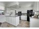 Modern kitchen with white cabinets and stainless steel appliances at 433 S Vaughn Way, Aurora, CO 80012