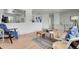Stylish living room with easy access to kitchen and hallway at 433 S Vaughn Way, Aurora, CO 80012