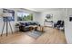 Bright living room with a large window and hardwood floors at 433 S Vaughn Way, Aurora, CO 80012