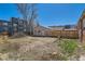 Spacious backyard with a detached garage and mature trees at 1540 Zenobia St, Denver, CO 80204