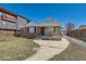 Charming brick home featuring a stone accent front porch and private driveway at 1540 Zenobia St, Denver, CO 80204