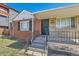Charming brick home with an inviting covered front porch at 1540 Zenobia St, Denver, CO 80204