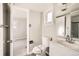 Simple bathroom with a toilet, sink and shower at 1230 Peoria St, Aurora, CO 80011