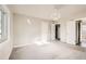 Bright bedroom with carpet flooring, neutral walls and an ensuite bathroom at 1230 Peoria St, Aurora, CO 80011