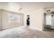 Open dining area with neutral walls and view into kitchen at 1230 Peoria St, Aurora, CO 80011