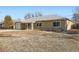 Brick ranch home with attached garage and mature trees at 1230 Peoria St, Aurora, CO 80011