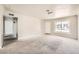 Bright and spacious living room with neutral walls and carpet at 1230 Peoria St, Aurora, CO 80011