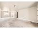 Open concept living room with large windows and neutral decor at 1230 Peoria St, Aurora, CO 80011