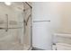 Bathroom with shower stall, toilet and grab bars at 14000 E Linvale Pl # 511, Aurora, CO 80014