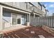 Cozy patio with mulch, a stone wall, and an entrance to the home at 1888 Oakcrest Cir, Castle Rock, CO 80104